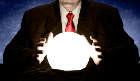 Businessman Consulting Glowing Crystal Ball
